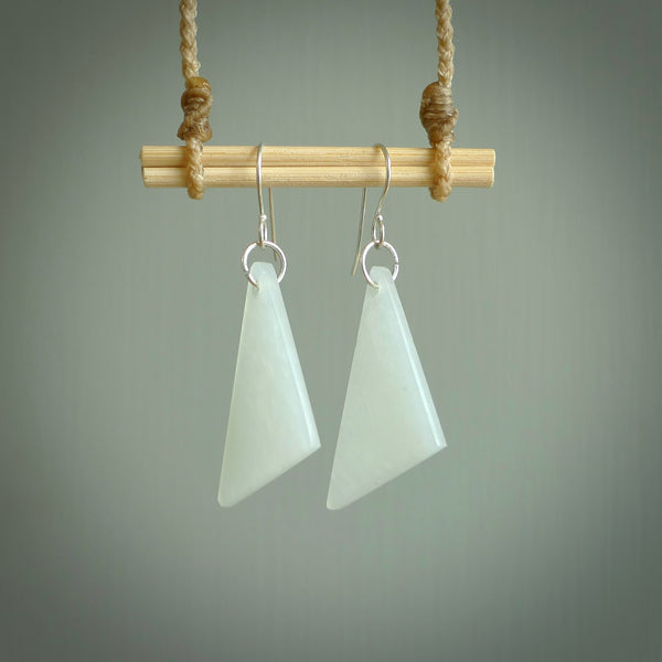 Hand carved by Rueben Tipene, these lovely triangular Jadeite earrings are hand made and an absolute delight. One pair only, postage is included in the price.