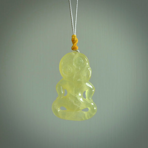 This little Prehnite crystal tiki has been carved to look and feel great. It has a softly carved face and is provided with a hand plaited cord. A gorgeous and small traditional piece that is great for children.