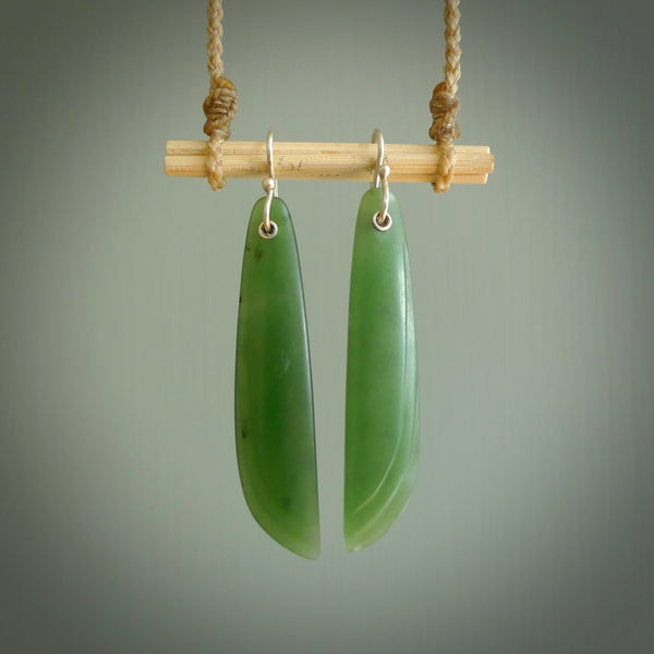 These are stunning large wing shaped drop jade earrings carved in New Zealand by Josey Coyle. It is carved from a apple green piece of New Zealand Jade and with Sterling Silver hooks.