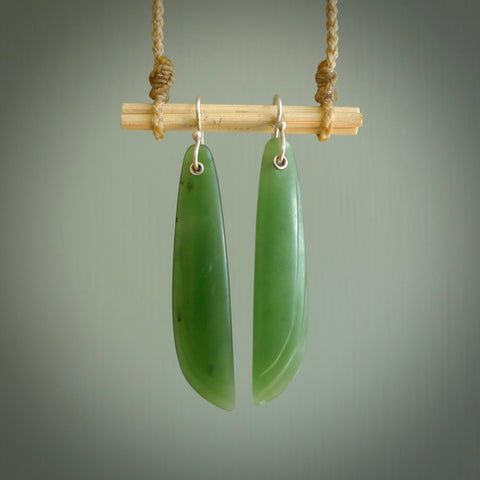 These are stunning large wing shaped drop jade earrings carved in New Zealand by Josey Coyle. It is carved from a apple green piece of New Zealand Jade and with Sterling Silver hooks.