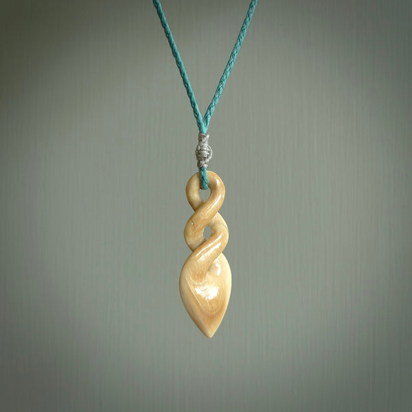 Hand carved woolly mammoth ivory twist pendant. Made by NZ Pacific.