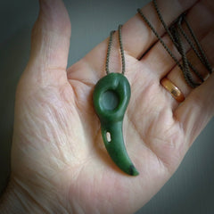 Hand carved huia bird skull made from New Zealand Marsden Jade pendant. Carved for NZ Pacific by Kyohei Noguchi. This is a contemporary piece of jewellery that is carved with intricate detail and clearly shows a beautiful bird skull. We ship this free worldwide with Express Courier.