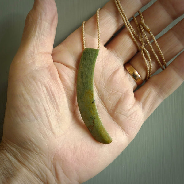 Hand carved pounamu drop pendant. Jade necklace hand made in New Zealand. A contemporary drop pendant carved from rare New Zealand flower jade. NZ Pacific jade jewellery for sale online.