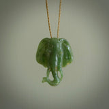 This is a handcarved elephant. Carved in a beautiful darker green piece of New Zealand jade. The cord is hand-plaited and length adjustable in a dark or pale green.