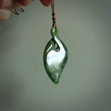 Hand carved New Zealand jade, single twist pendant. Maori pikorua pendant hand carved in New Zealand. Made by NZ Pacific, jade jewellery for sale online. One only hand made by Ross Crump.