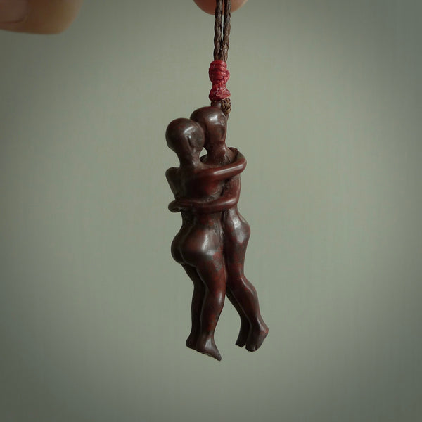 This medium sized couples embrace pendant is made from Red Jasper Stone. We've hand carved this piece for all the lovers out there. Free postage worldwide. Red Jasper Stone couple hugging jewellery.