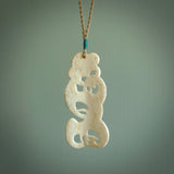 Hand carved large bone Tiki pendant. Traditional art hand carved for NZ Pacific. Bone Tiki necklace with Paua Shell eyes.