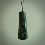 Hand made New Zealand jade drop with koru pendant. Hand carved in New Zealand by Kerry Thompson. Hand made jewellery. Unique large Jade drop with fixed length Manuka/Olive coloured cord. Free shipping worldwide.