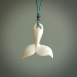 Hand carved bone whale tail pendant. Made by NZ Pacific. Bone whale tail necklace with adjustable cord.
