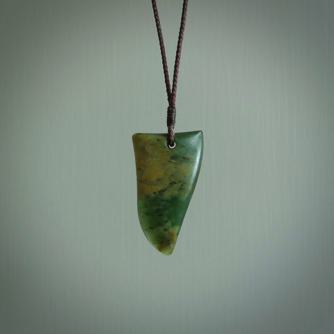 Hand carved jade niho, fang, pendant. Carved by New Zealand artist Ric Moor. Contemporary New Zealand Jade fang, drop necklace. One only unique pendant for men and women.