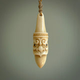 Hand carved incredible stained bone gargoyle face carving. A stunning work of art. This pendant was hand carved in bone with buffalo horn inlay for the eyes by Yuri Terenyi. A one off collectors item that has been hand crafted to be worn or displayed.