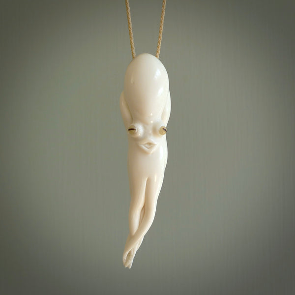 Hand carved octopus pendant in resting pose. This piece has been carved in incredible detail from bone. The artist is Fumio Noguchi, a renowned New Zealand bone carver who carves pieces for NZ Pacific. These unique bone pendants are for sale online at nzpacific.com One only collectors item for lovers of the ocean and octopus.