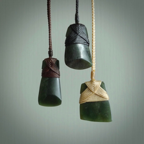 Hand carved jade toki by Ric Moor. Made in New Zealand by NZ Pacific. Hand carved Toki pendants crafted from beautiful New Zealand Pounamu, Jade. We deliver these with Express Courier, on adjustable cords.