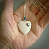 HAND CARVED HEART PENDANT. CARVED FROM BONE. PAUA HEART INSERT. HAND MADE BY NZ PACIFIC. HANDMADE JEWELLERY FOR SALE ONLINE.