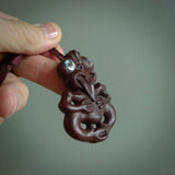 This is a medium sized tiki - carved from gorgeous red Jasper Stone. The craftsmanship is superb, this piece is as well carved as any we have seen. The cord is an adjustable plaited cord in Wapiti Brown and Burgundy.