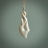 Hand carved stellar intricate twist carving with hook design. A stunning work of art. This pendant was hand carved by Fumio Noguchi, in Bone. A one off collectors item that has been hand crafted to be worn or displayed.