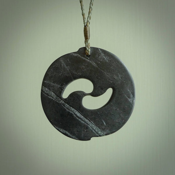 Hand made large New Zealand Pounamu, Jade Koru pendant. Hand carved in New Zealand by Rueben Tipene. Hand made jewellery. Unique large Greenstone Koru with adjustable cord. Free shipping worldwide.