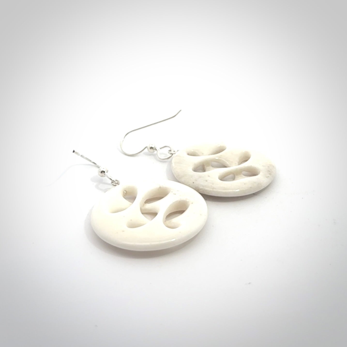 Hand carved bone earrings. Hand made by Amanda Thompson. One only bone earrings. Real bone art to wear. Free Shipping worldwide.