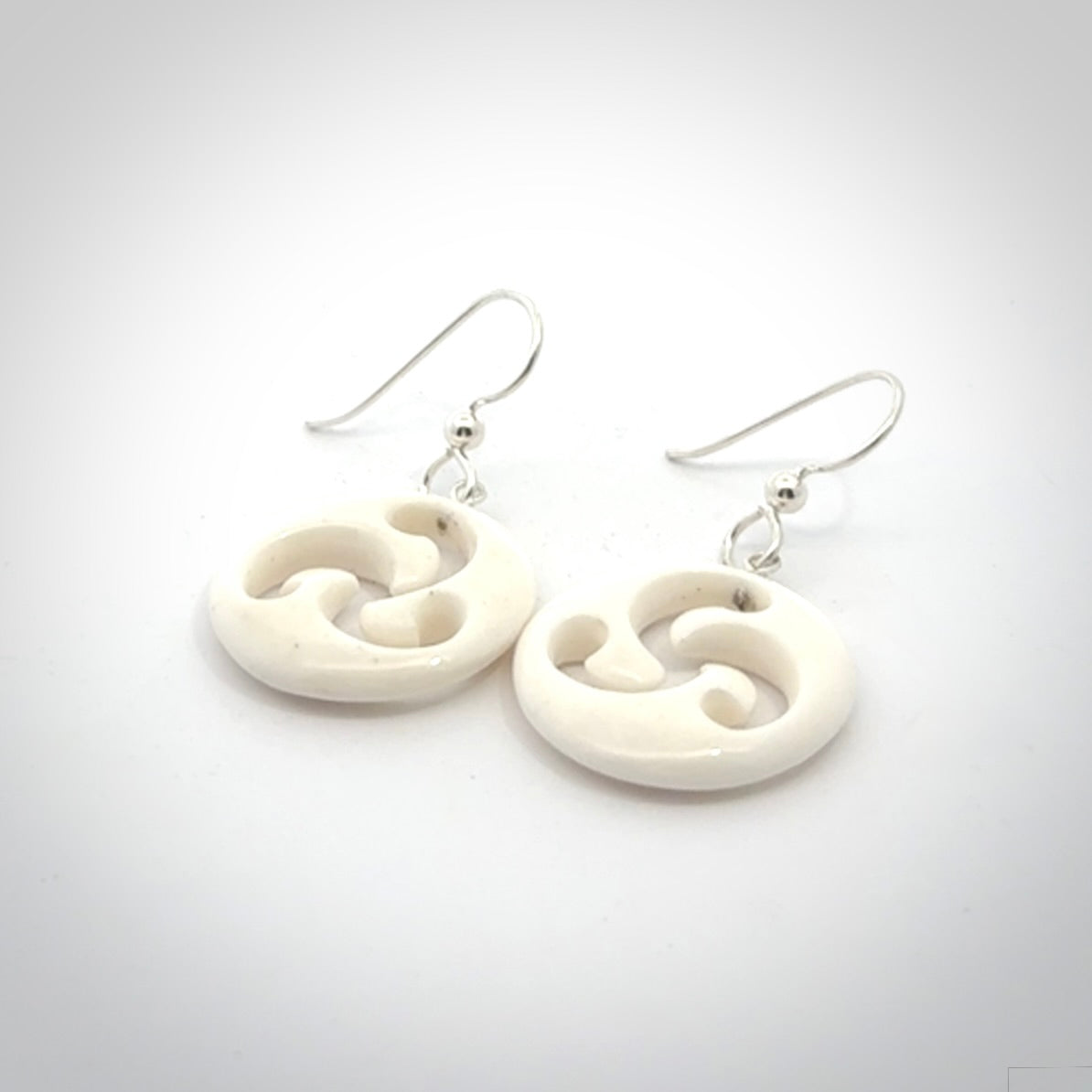 Hand carved bone earrings. Hand made by Amanda Thompson. One only bone earrings. Real bone art to wear. Free Shipping worldwide.