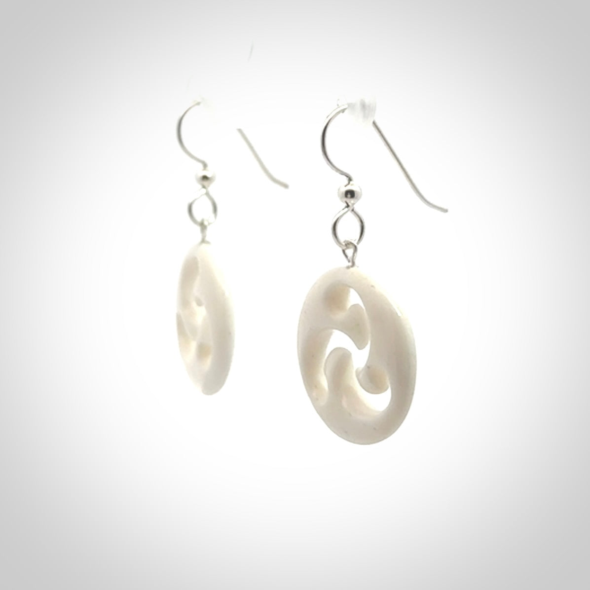 Hand carved bone earrings. Hand made by Amanda Thompson. One only bone earrings. Real bone art to wear. Free Shipping worldwide.