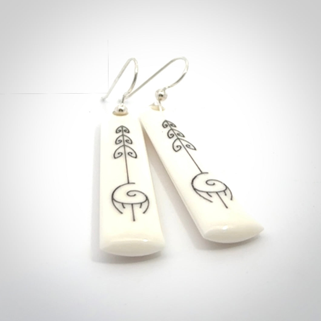Hand carved large bone earrings with dreamcatcher engraving.