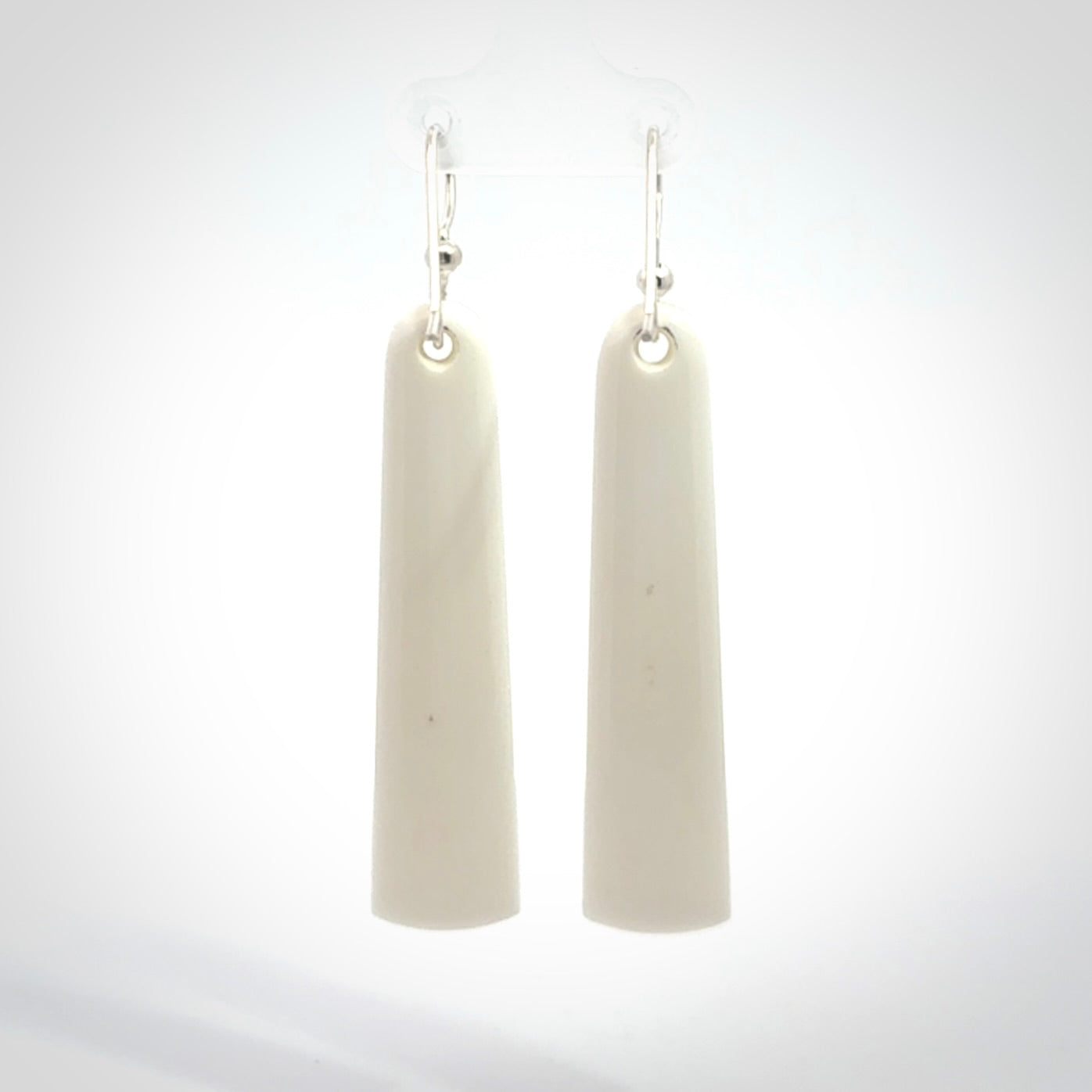 Hand carved large bone earrings with dreamcatcher engraving.