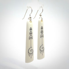 Hand carved large bone earrings with dreamcatcher engraving.