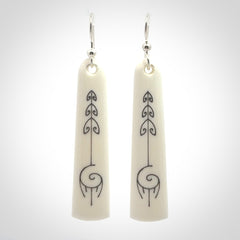 Hand carved large bone earrings with dreamcatcher engraving.