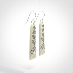 Hand carved bone koru earrings with double sided engraving.