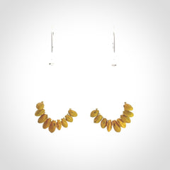 Hand carved New Zealand Kōwhai seed earrings.