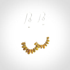 Hand carved New Zealand Kōwhai seed earrings.