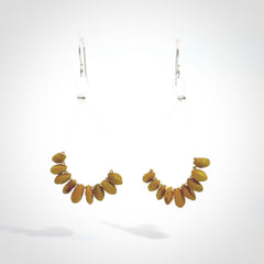 Hand carved New Zealand Kōwhai seed earrings.