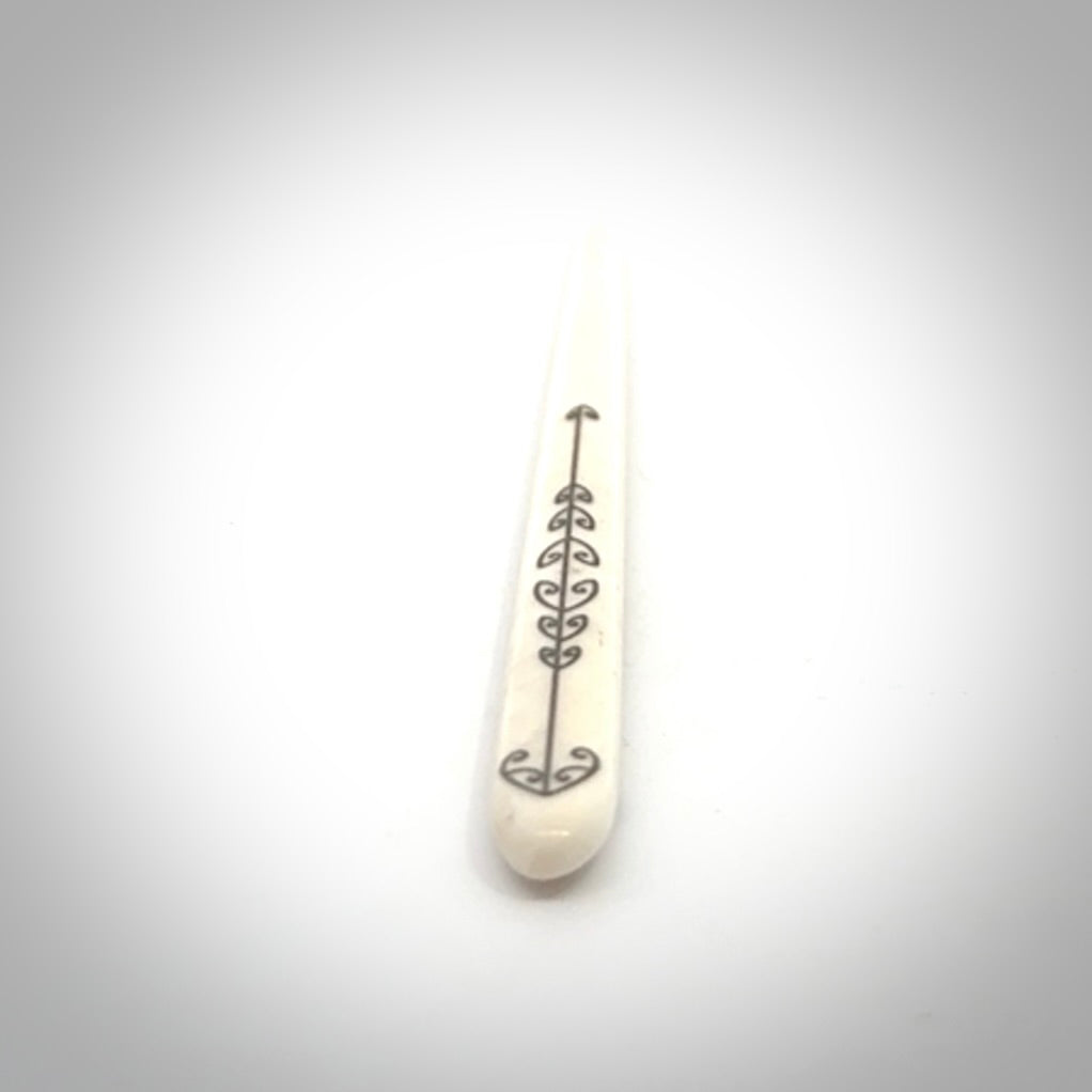 Hand carved bone hair pin with double sided koru design.