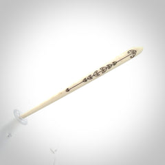 Hand carved bone hair pin with double sided koru design.