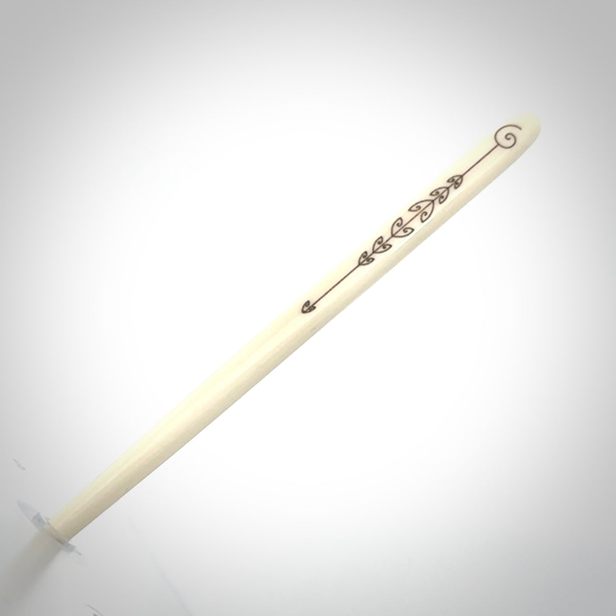 Hand carved bone hair pin with double sided koru design.