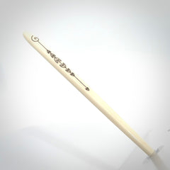 Hand carved bone hair pin with double sided koru design.