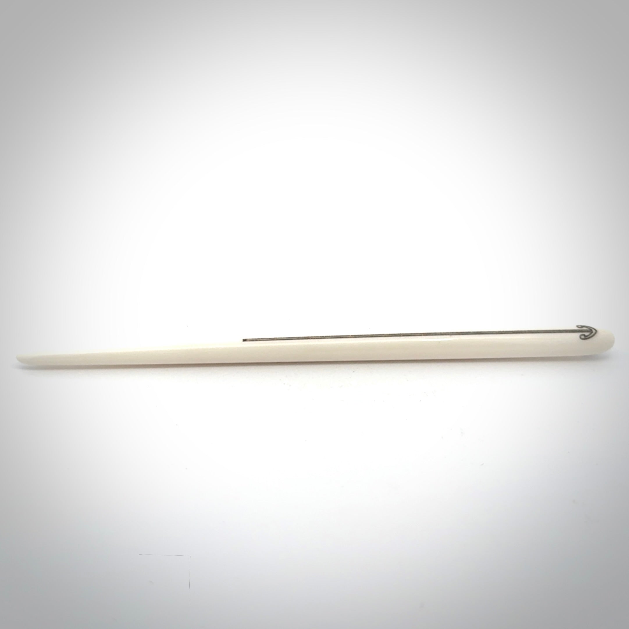 Hand carved bone hair pin with double sided koru design.