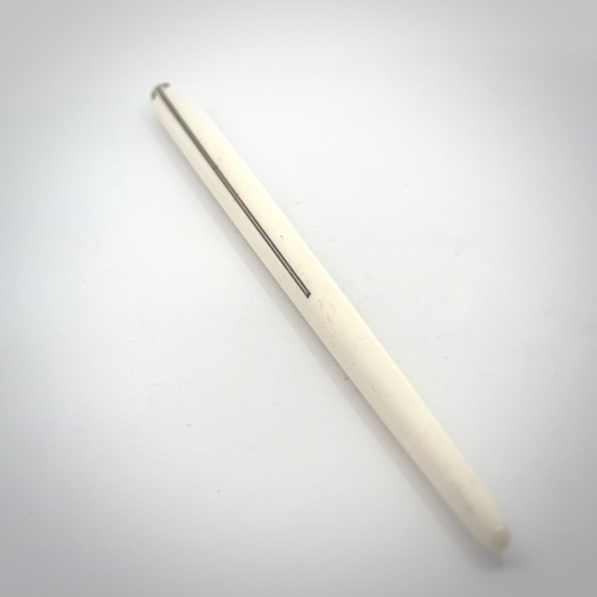 Hand carved bone hair pin with double sided koru design.