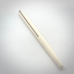 Hand carved bone hair pin with double sided koru design.