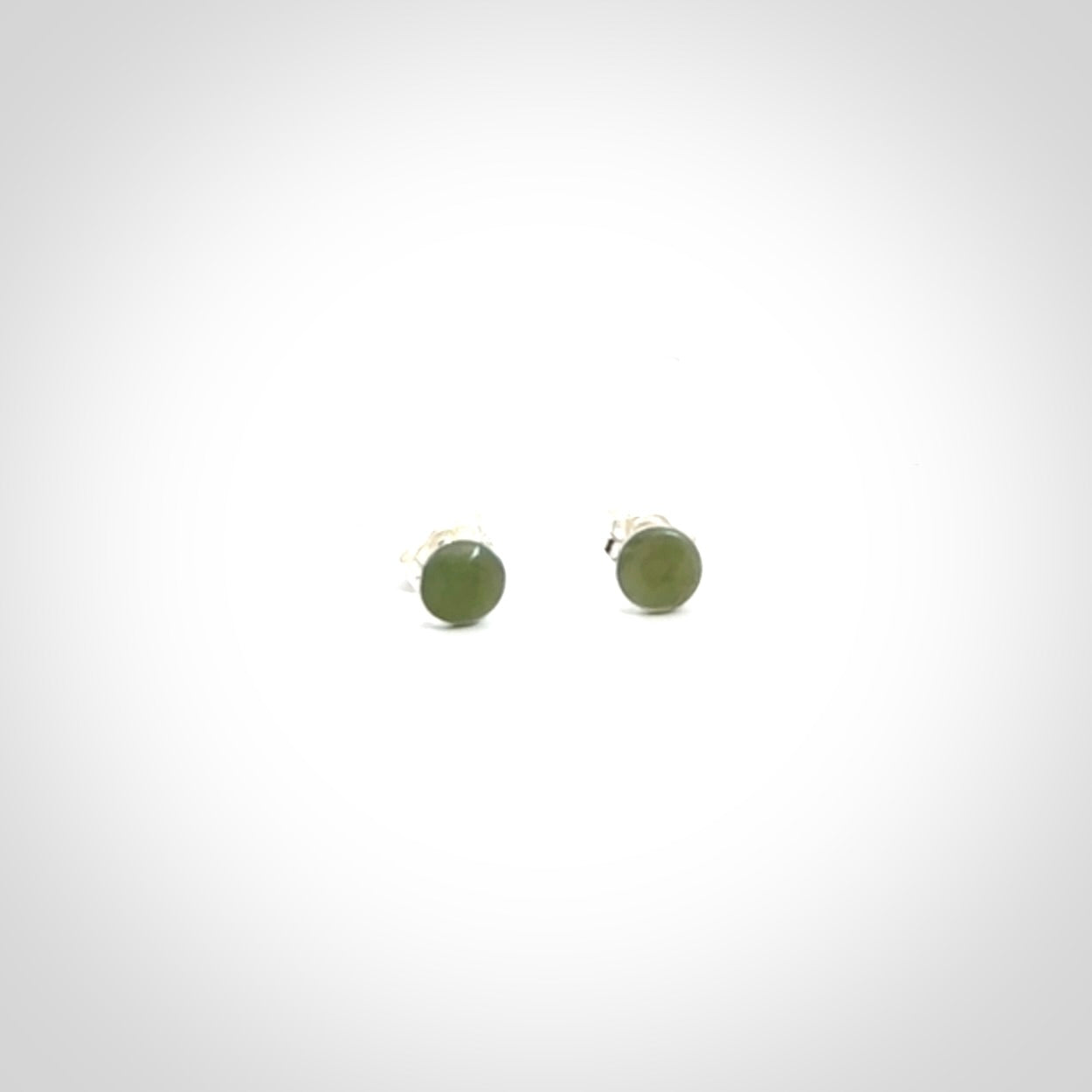 Hand carved small New Zealand Jade and Sterling Silver stud earrings.