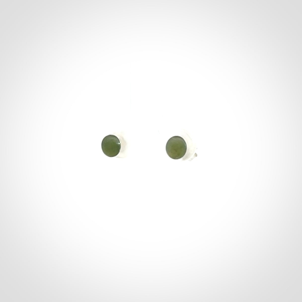 Hand carved small New Zealand Jade and Sterling Silver stud earrings.