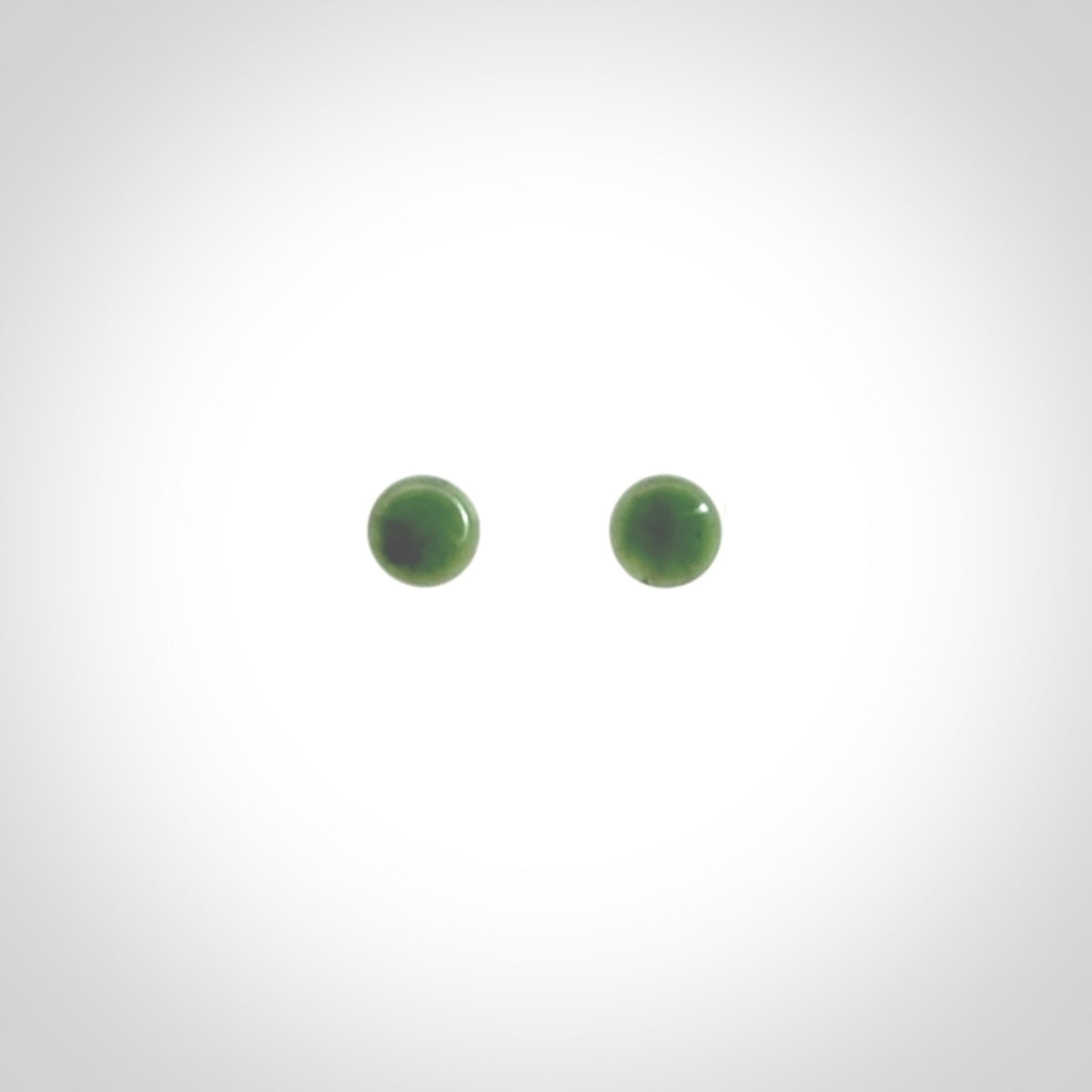 Hand carved small New Zealand Jade and Sterling Silver stud earrings.