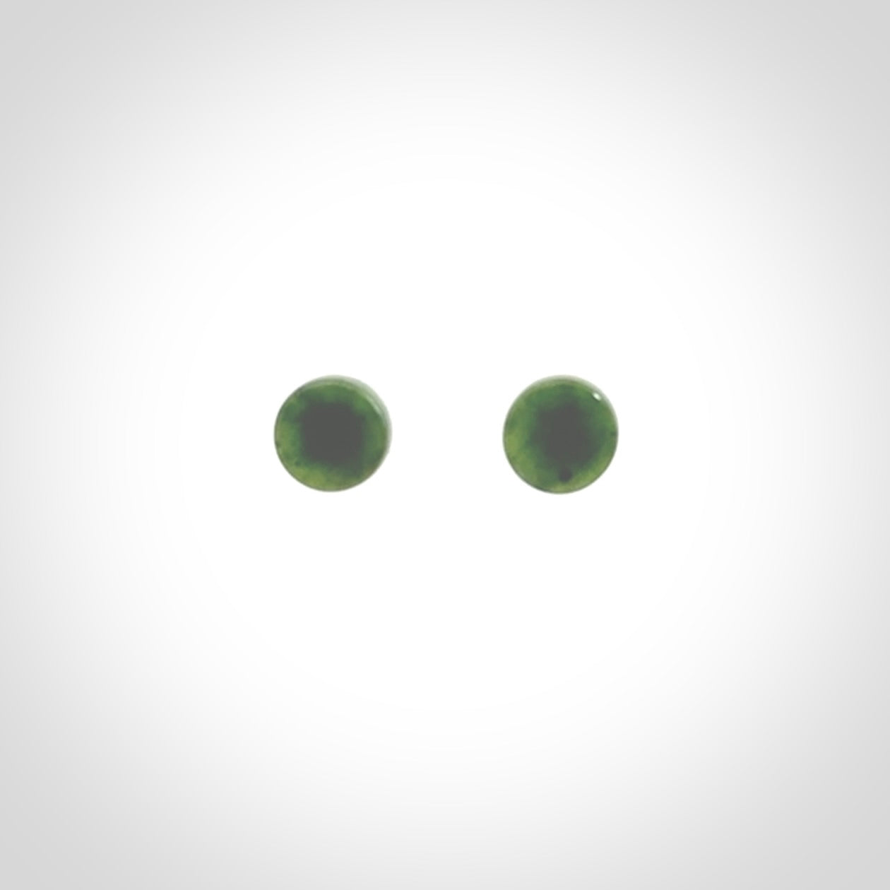 Hand carved New Zealand Jade and Sterling Silver stud earrings.