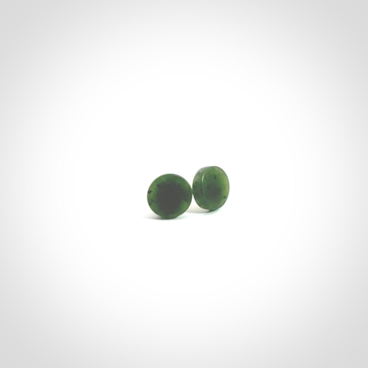 Hand carved New Zealand Jade and Sterling Silver stud earrings.