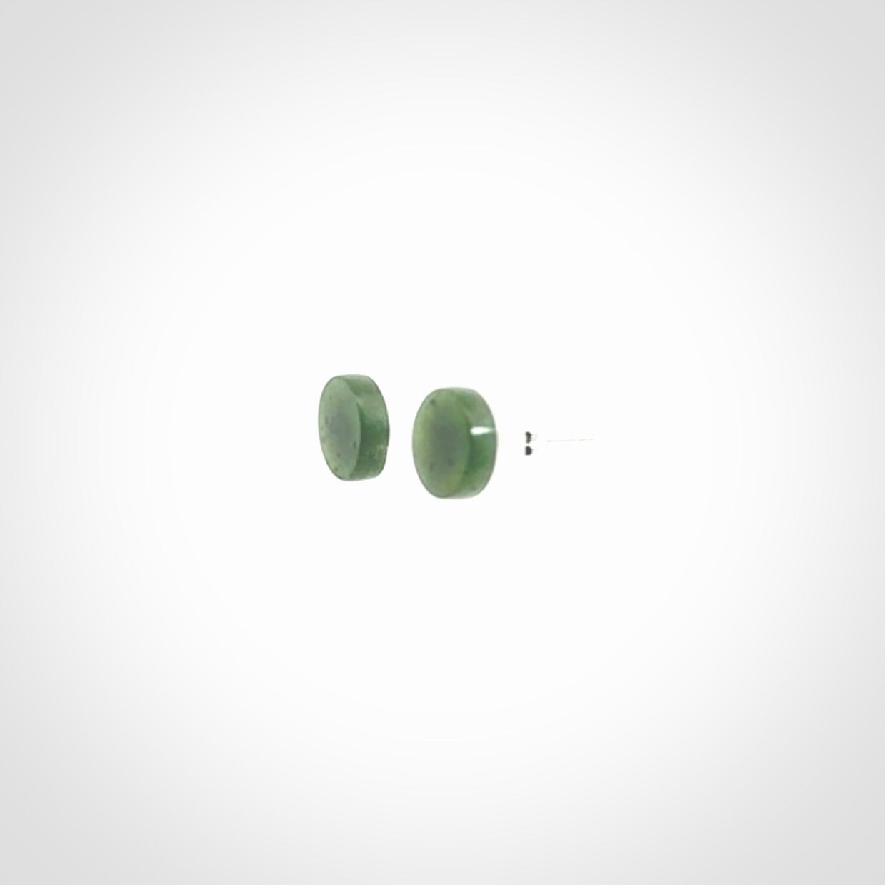 Hand carved New Zealand Jade and Sterling Silver stud earrings.