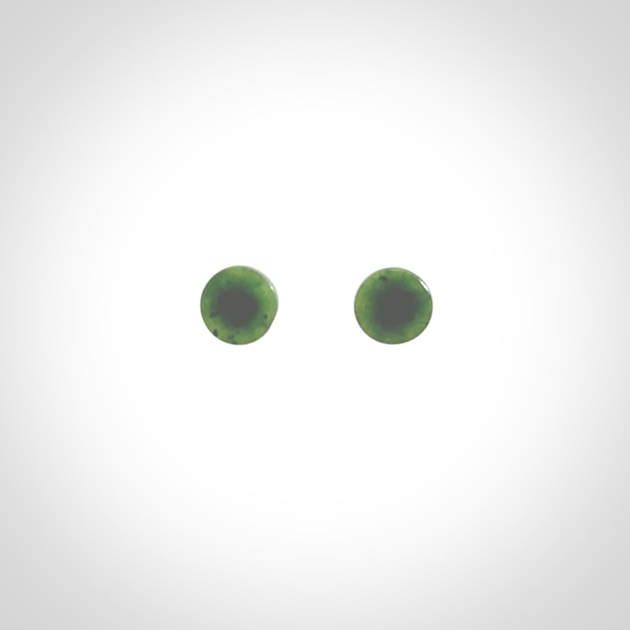 Hand carved New Zealand Jade and Sterling Silver stud earrings.