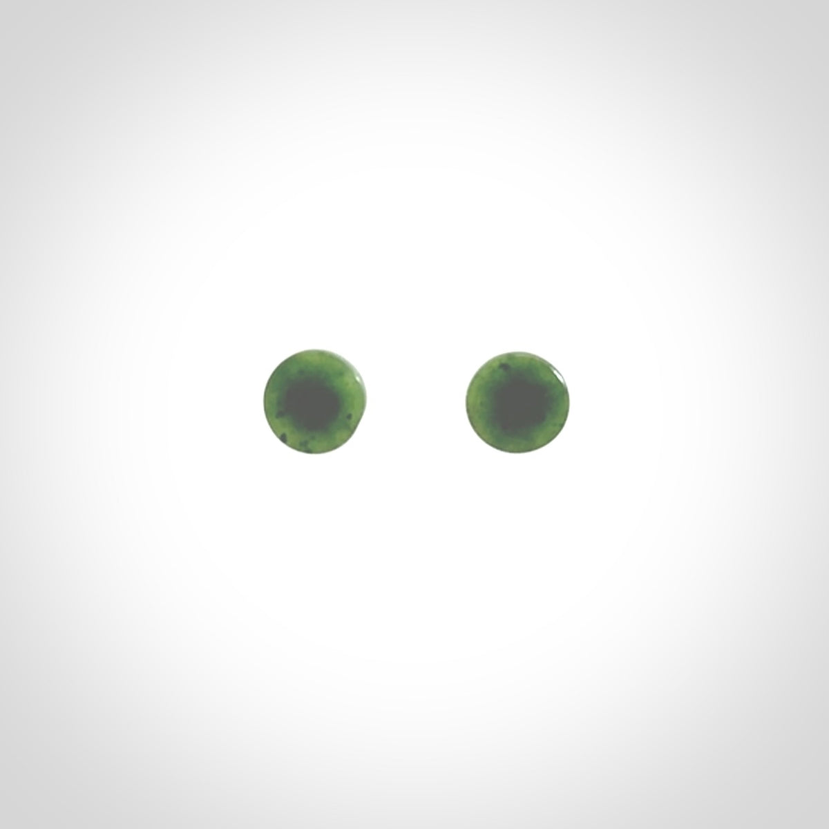 Hand carved New Zealand Jade and Sterling Silver stud earrings.