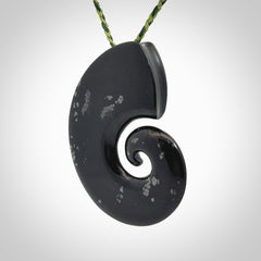 A hand carved koru pendant from New Zealand Tangiwai Pounamu. The cord is a Fern/Manuka Green colour and is an adjustable length. A large hand made Koru necklace by New Zealand artist Kerry Thompson.