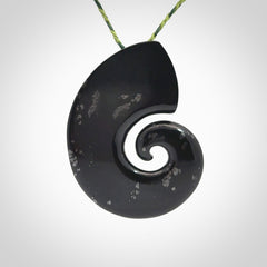 A hand carved koru pendant from New Zealand Tangiwai Pounamu. The cord is a Fern/Manuka Green colour and is an adjustable length. A large hand made Koru necklace by New Zealand artist Kerry Thompson.