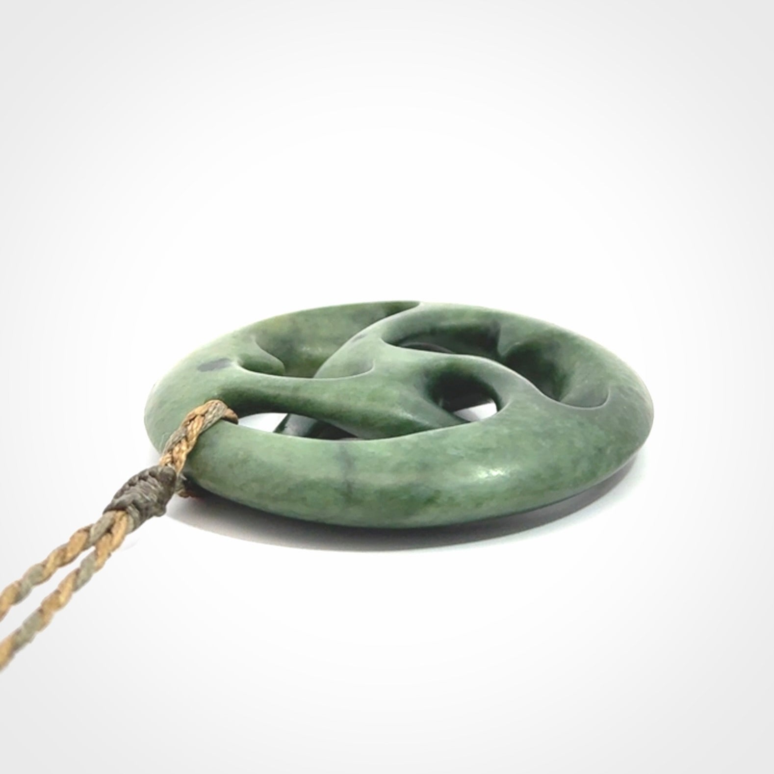 Hand carved New Zealand jade, complex twist drop pendant. Hand made complex twist pendant hand carved in New Zealand.